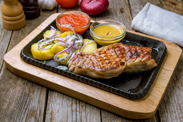 Sticker - Fried pork loin with sauce on board