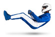 © stockphoto-graf - Race driver in blue white motorsport overall hover over ground in driving seat position with shoes gloves and safety crash helmet, isolated white abstract racing background.