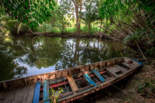 The Background Of The Fishing Boats That Park Alongside The River, The Atmosphere Is Surrounded By Nature (trees, Bamboo Groves) With Wind Blowing All The Time