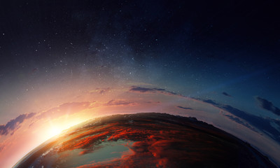 Earth with sunrise on blue space background