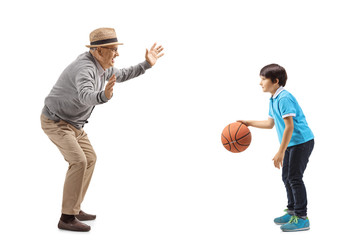 Wall Mural - Grandfather playing basketball with his grandson