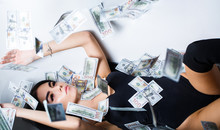 Rich Sexy Woman Lies On Money. Currency, Women, Winning. Sexy Female And Dollar Bills. Sexy Woman Lying In Dollar Bills. Woman With Lot Of Money. Millionaire Woman Lying In Bedroom