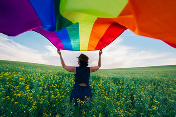 Gay Rainbow Flag on a green meadow outdoors