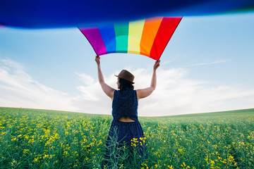 Gay Rainbow Flag on a green meadow outdoors