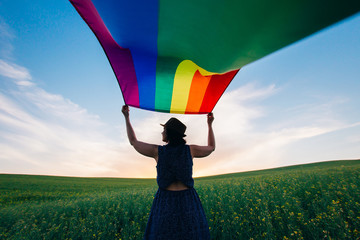 Gay Rainbow Flag on a green meadow outdoors