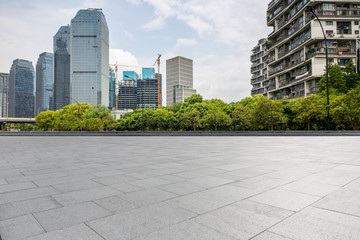 Wall Mural - Panoramic skyline and modern business office buildings with empty road,empty concrete square floor