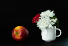 Red White Flower In White Ceramic Mug And Apple Fruit For Food Rococo Classic Still Life Style On Black Background