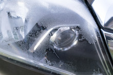 Car Headlights Covered In Frost On Early Autumn Morning.  Droppi