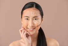 Asian Woman With Contouring Makeup On Color Background