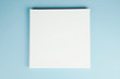 © meteoritka - Mock-up poster. Blank square canvas on stretcher on blue wall.