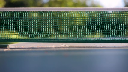 Table tennis pin pong net detail bokeh pan, summer mood background