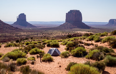 Canvas Print - Morning in the Monument Valley. Tourist tents amid the crumbling rocks of Arizona