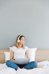 Canvas Print - Beautiful young blonde woman relaxing in bed