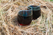 Cups with kvass standing in the hay