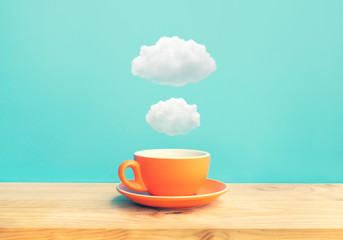 inspiration creativity concepts with a cup of coffee on wood bar table with some cloud on blue sky c