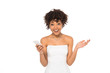 © LIGHTFIELD STUDIOS - happy african american bride showing shrug gesture while holding smartphone isolated on white