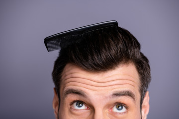 Cropped close up photo amazing he him his macho plastic styling brush stuck thick hair  oh no take care hairdo barber shop stylist look up process wear casual white t-shirt isolated grey background