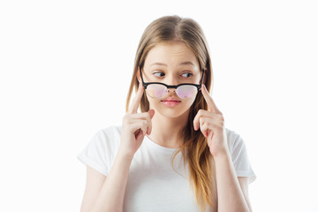 Wall Mural - teenage girl touching glasses and looking away isolated on white