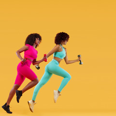 Wall Mural - Two strong athletic, women sprinter or runner, running on yellow background with dumbbells wearing color sportswear. Fitness and sport motivation.