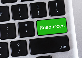 Green computer keyboard button with Resources word