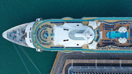  Aerial top view of cruise ship docked in Mediterranean destination