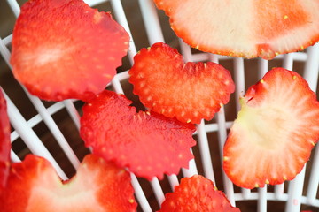 Strawberry berries cut dry plastic grid dryers