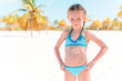 © travnikovstudio - Beautiful little girl at beach having fun. Funny girl enjoy summer vacation.