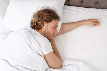 Sticker - Handsome young man sleeping on pillow, view from above. Bedtime