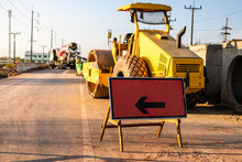 Arrow Direction Sign For Road Work At Construction Site.