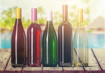 Canvas Print - Wine bottles in row isolated on white background