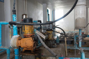 Wall Mural - Old water pumping and water pipes in water treatment plant