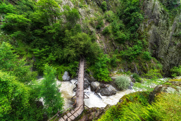 Beautiful wooden hand-made bridge in the Ecopath White River, near Kalofer, Bulgaria.