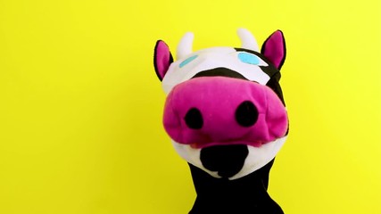 Wall Mural - hand puppet cow on yellow background,puppet theatre