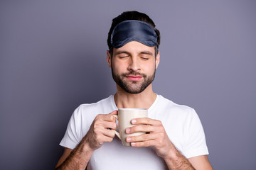 Poster - Close-up portrait of his he nice-looking attractive calm bearded guy holding in hands mug smelling espresso aroma caffeine isolated over gray pastel violet purple background