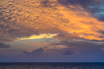 The waves in the sea during the twilight, the colorful sky, looking from the top view.