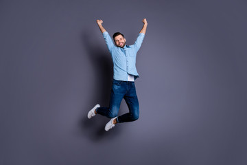 Poster - Full length body size view portrait of his he nice cool content cheerful cheery optimistic macho guy rising hands jumping up having fun isolated over gray violet purple pastel background