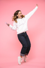 Poster - Full length image of Happy woman wearing in casual clothes