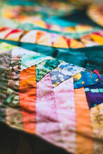 Close Up Shallow Focus Detail From A Handmade Vintage Patchwork Quilt