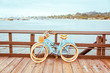 Santa Barbara romantic concept on sea, beach, yacht club panorama background. Two retro bicycles standing on Santa Barbara pier, California, USA. Vintage filter with muted teal blue and orange colors.