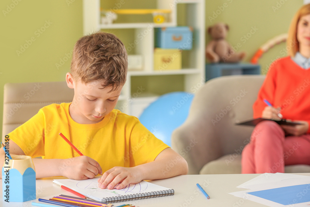 Little boy with autistic disorder at child psychologist's office
