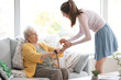 © Pixel-Shot - Caregiver with senior woman in nursing home