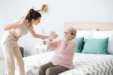 Poster - Caregiver mistreating senior woman in nursing home