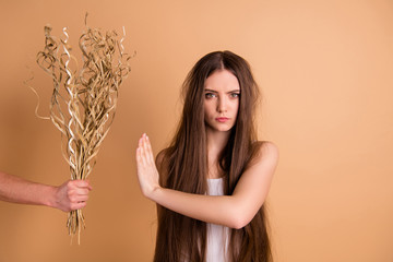 Sticker - Close-up portrait of her she nice-looking attractive grumpy gloomy lady refusing to take dried flower messy thin weak hair chevelure season spring hormonal change isolated on beige pastel background