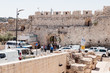 Tourists pass through the Dung Gates in the Old City of Jerusalem, Israel