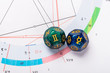 Astrology Dice with zodiac symbol of Gemini May 21 - Jun 20 and its ruling planet Mercury on Natal Chart Background