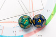 Astrology Dice with zodiac symbol of Sagittarius Nov 22 - Dec 21 and its ruling planet Jupiter on Natal Chart Background