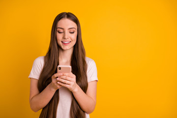 Poster - Close up photo beautiful amazing she her lady very long hairstyle wondered hold hands arms telephone read romantic letters boyfriend wear casual pastel t-shirt isolated yellow bright background