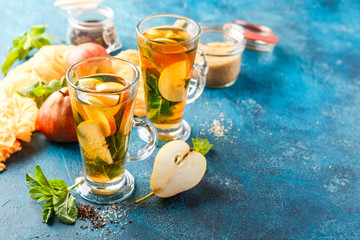 Wall Mural - Hot fruit tea with ripe pears and mint