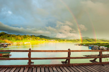 Double Rainbows Over The Lake And Houseboat Community On Rainy Day.