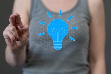  holding illuminated light bulb, idea, innovation and inspiration concept.